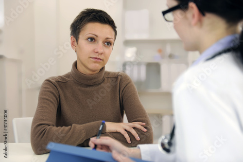 Photo: Psychologist and depressed patient at office Psychologist and depressed patient at office