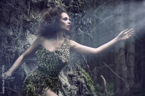 Photo: Beauty woman as a part of tree Beauty woman as a part of tree