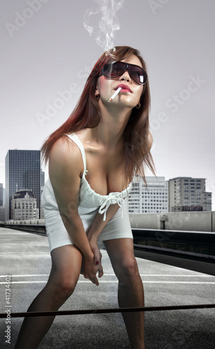 Photo: woman smoking cigarette woman smoking cigarette