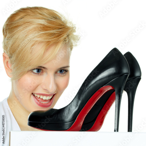 Photo: Pretty young woman loves her sexy shoes Pretty young woman loves her sexy shoes