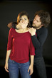 Man holding womans mouth violence