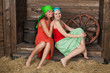 Young girls resting on a hayloft