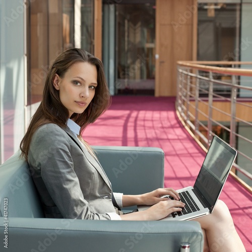 Photo: Businesswoman working on laptop Businesswoman working on laptop