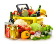 Plastic shopping basket and grocery isolated on white