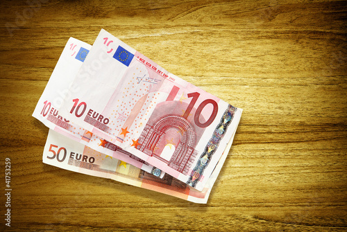 Photo: euro banknotes on desk euro banknotes on desk