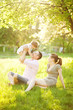 happy young family spending time outdoor on a summer day