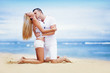 Young beautiful caucasian couple on the beach