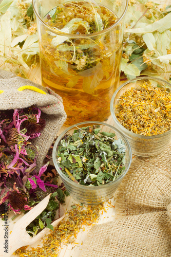 Photo: healing herbs and healthy tea on wooden table, herbal medicine healing herbs and healthy tea on wooden table, herbal medicine