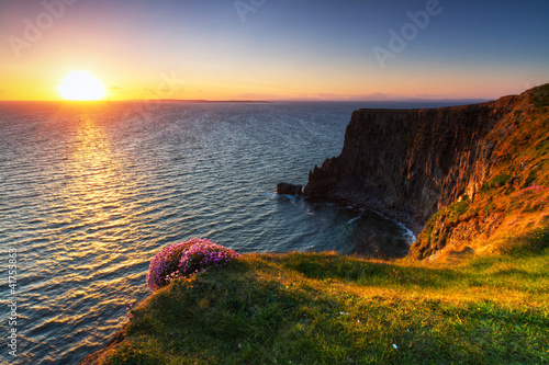 Photo: Cliffs of Moher at sunset in Co. Clare, Ireland Cliffs of Moher at sunset in Co. Clare, Ireland