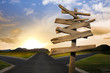 crossroads with confusing directional arrow sign