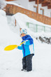 The boy goes for a drive on an snow slope. The boy goes for a drive on an snow slope.