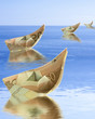 petits bateaux sur l'eau, billets de 50 € sur mer