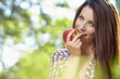Beautiful woman  in the garden with apples