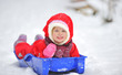 Little girl on sleigh