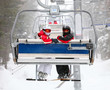 Photo: Skiers on a ski-lift Skiers on a ski-lift