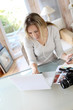 Woman working at home on laptop computer