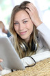Young modern girl using electronic tablet