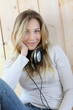 Young modern girl listening to music with electronic tablet Young modern girl listening to music with electronic tablet