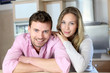 Portrait of in love couple standing in home kitchen