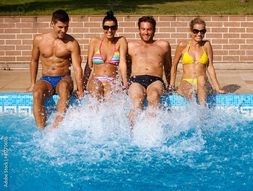 Photo: Young people having summer fun by pool Young people having summer fun by pool