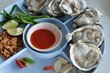 Fresh oyster seafood served with lemon Fresh oyster seafood served with lemon
