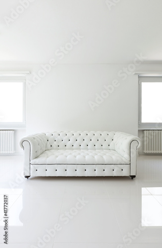 Photo: interior, leather sofa in white room interior, leather sofa in white room