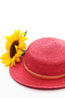 Red straw hat with sunflower