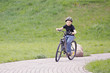 Smiling boy cycling in park