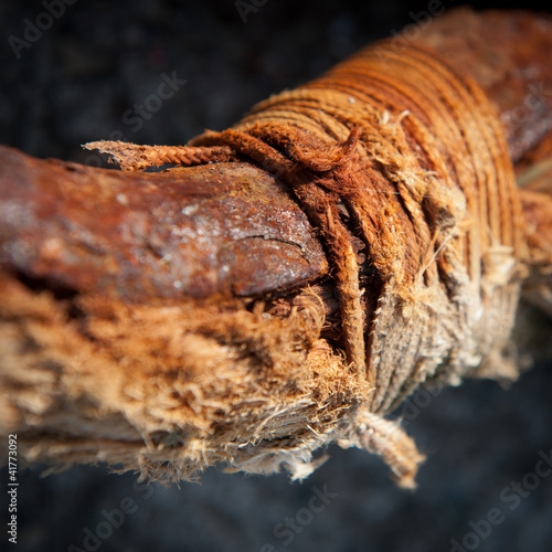 Photo: Rotten cord and rusty iron Rotten cord and rusty iron