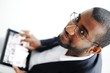 Handsome African American man with tablet computer