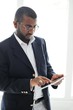 Handsome African American man with tablet computer