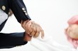 Closeup of business people shaking hands over a deal