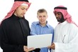 A business team of three planning work in office