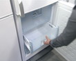 product demonstration in shop. refrigerator door drawers closing