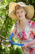pretty lady holding sheers in garden pretty lady holding sheers in garden