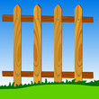 wooden fence in park with blue sky in background