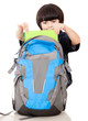 Boy taking notebooks out of backpack
