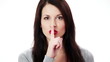 Young woman gesturing for quiet or shushing Young woman gesturing for quiet or shushing