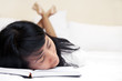 Tired woman reading a book Tired woman reading a book