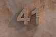 The number 41 carved from marble on marble base