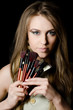 The beautiful girl with brushes for a make-up