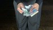 business trousers counting money