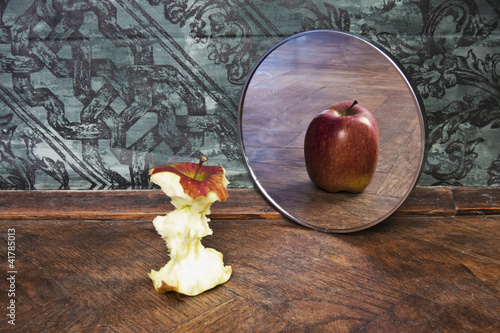 Photo: surrealistic picture of an apple reflecting in the mirror surrealistic picture of an apple reflecting in the mirror