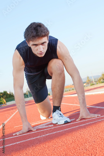Photo: Determined an athlete is ready to start Determined an athlete is ready to start