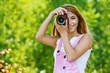 smiling young woman with camera