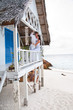 Romantic young couple in tropical beach house
