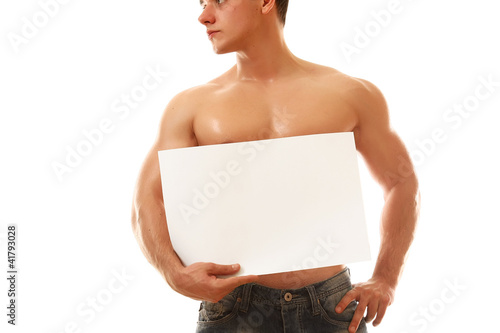 Photo: A muscular man with a blank A muscular man with a blank