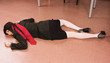 Business woman lying on the floor. Crime scene simulation