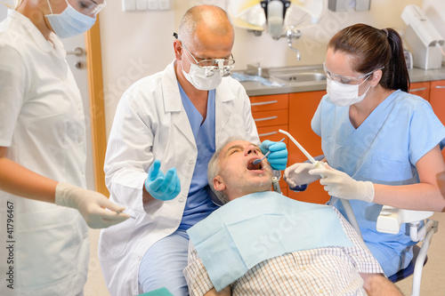 Photo: Senior man at dentist surgery have operation Senior man at dentist surgery have operation