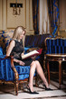 Blonde woman reading menu book